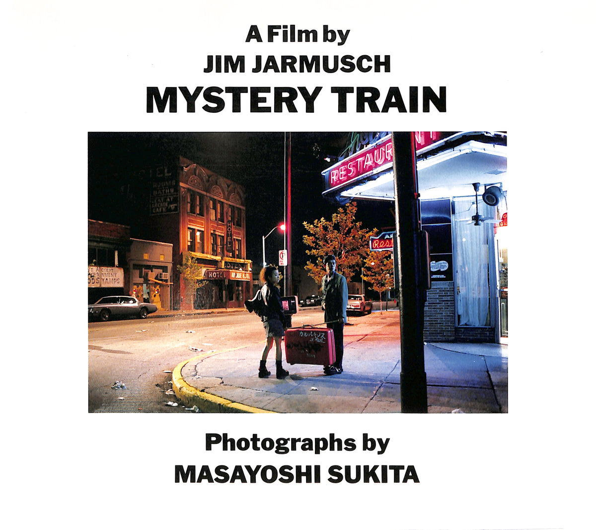 Cover - JIM JARMUSCH & MASAYOSHI SUKITA / MYSTERY TRAIN. Book cover of 'Mystery Train' by Jim Jarmusch with a photograph of two people on a street corner.