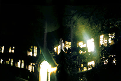 Interior page of HIROMIX / Hikari. Dark, eerie scene of a building with glowing windows at night