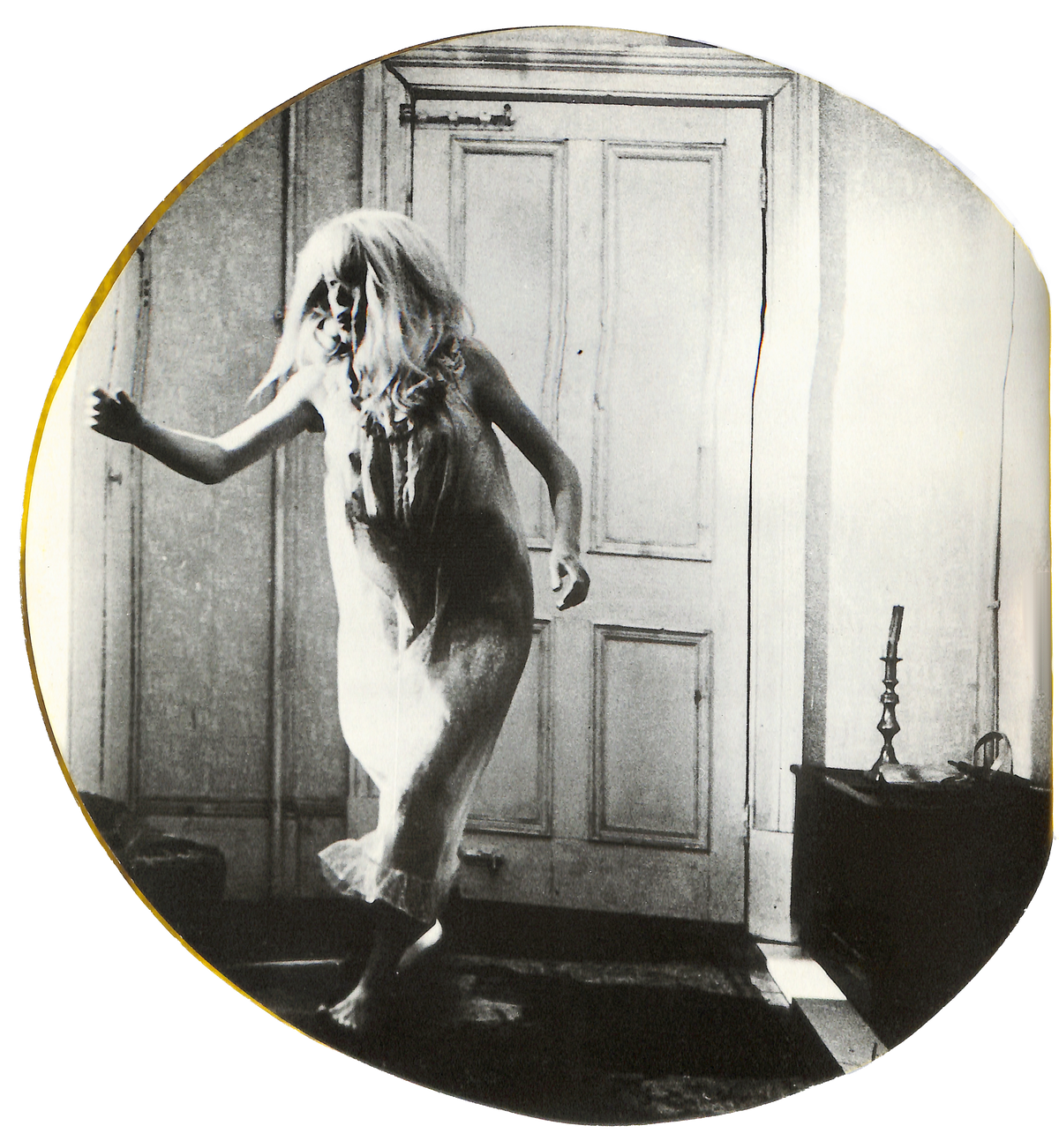 Interior image of - ROMAN POLANSKI / Knife in the Water. Black and white image of a person in a room with a door.