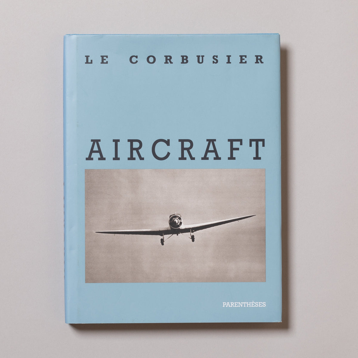 Book cover of 'Aircraft' by Le Corbusier with an airplane image on a light blue background